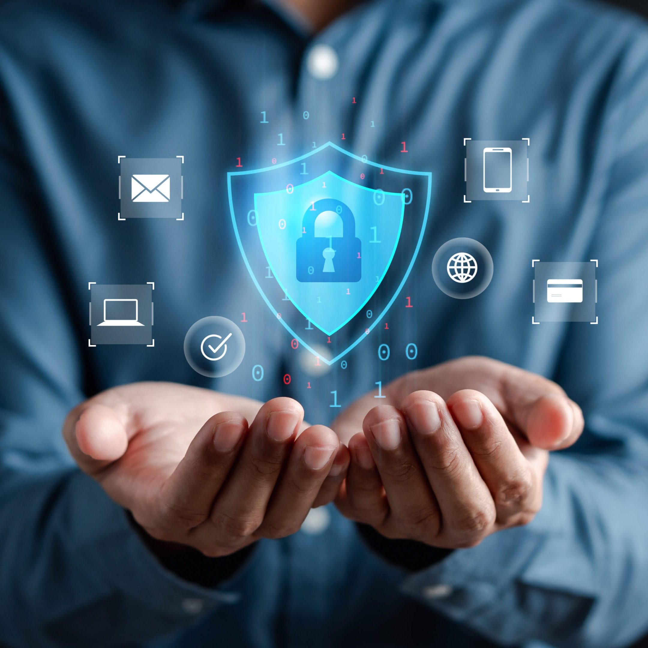 Hands holding digital security icons and shield.