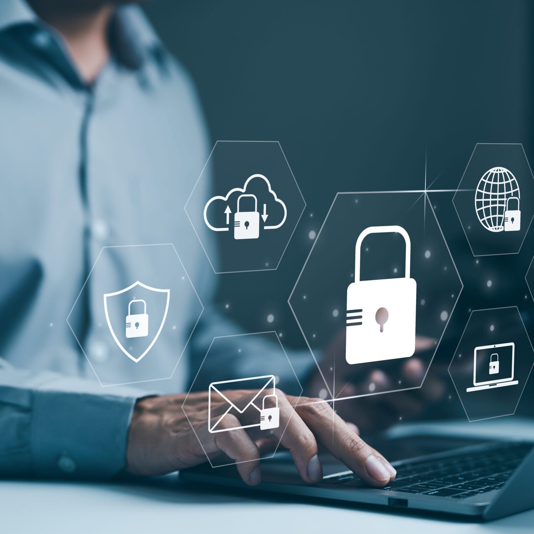 Person typing with digital security icons overlay.
