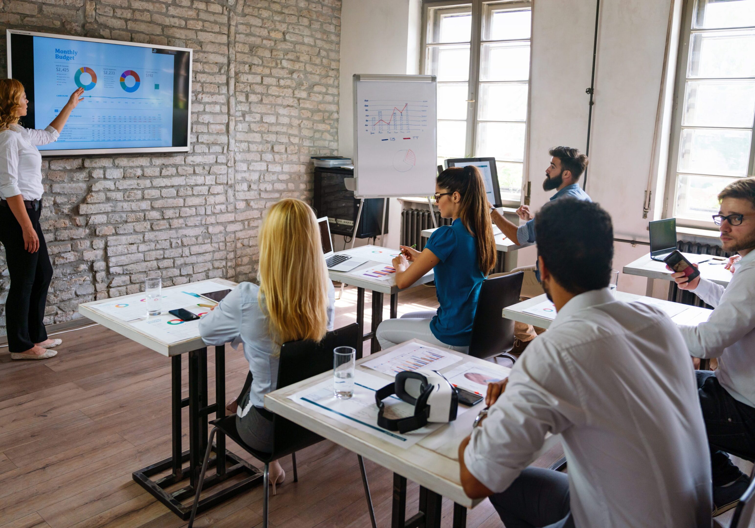 Team meeting with a presentation screen.