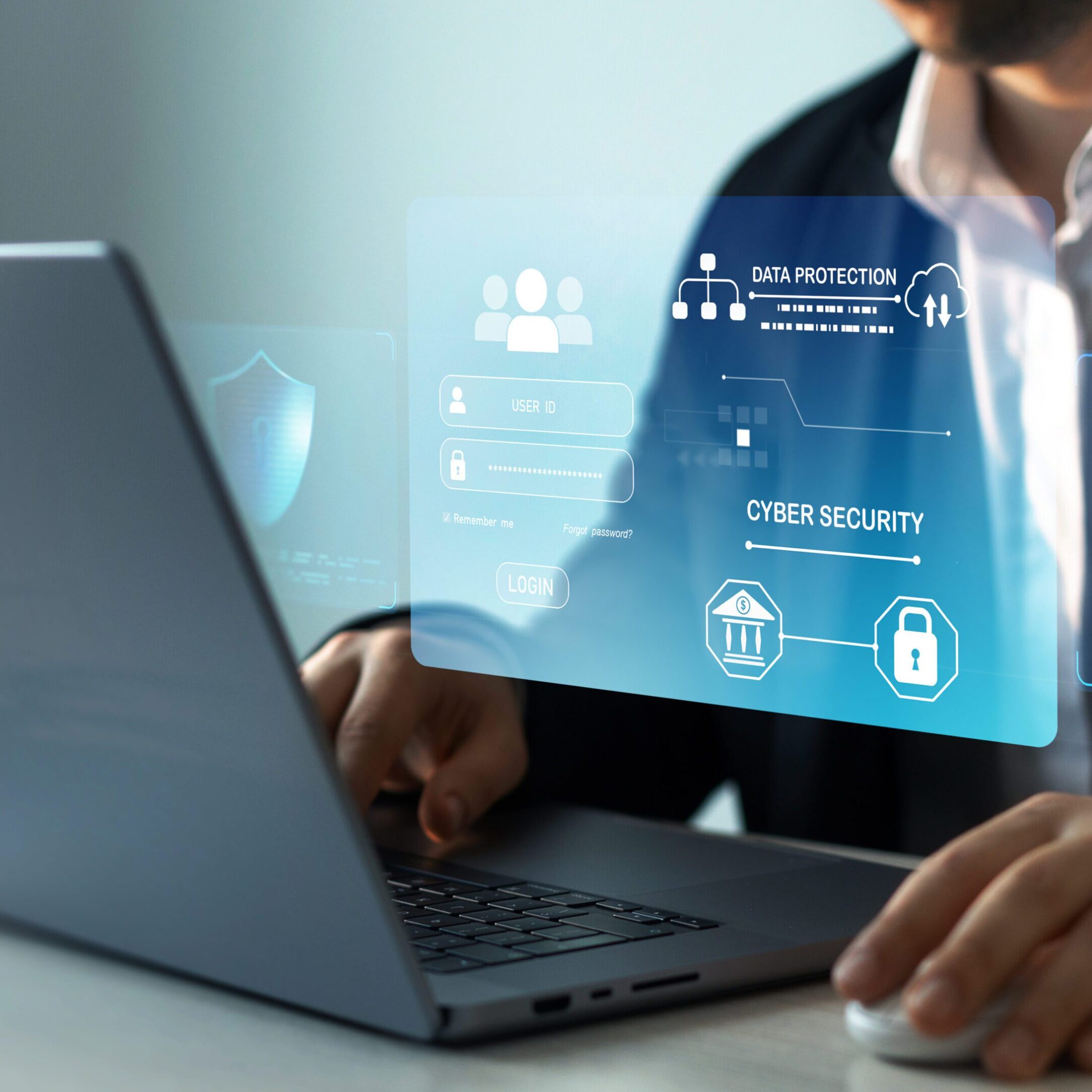 Man working on laptop with cybersecurity interface.